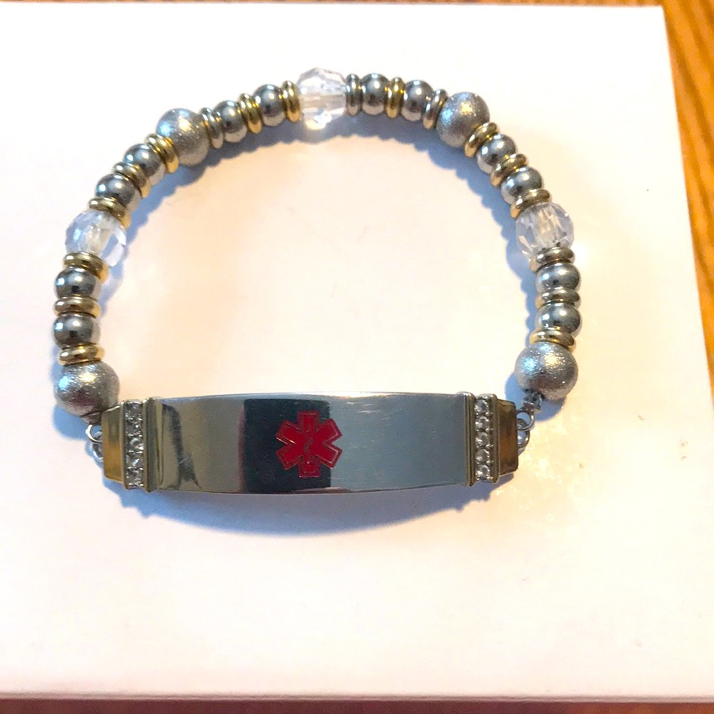 Medic alert bracelet with silver, gold and clear fluted beads